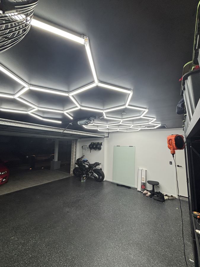 Custom hexagon LED lighting installed in a home garage