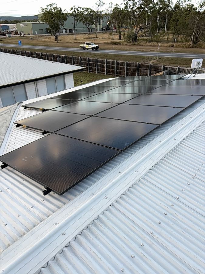 Rooftop solar panel installation on a commercial shed roof